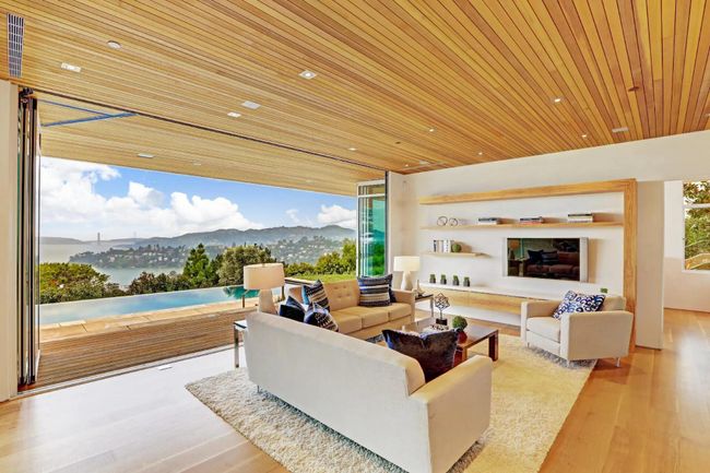 Renovated living room in Tiburon overlooking the Golden Gate Bridge. Window by NanaWall company